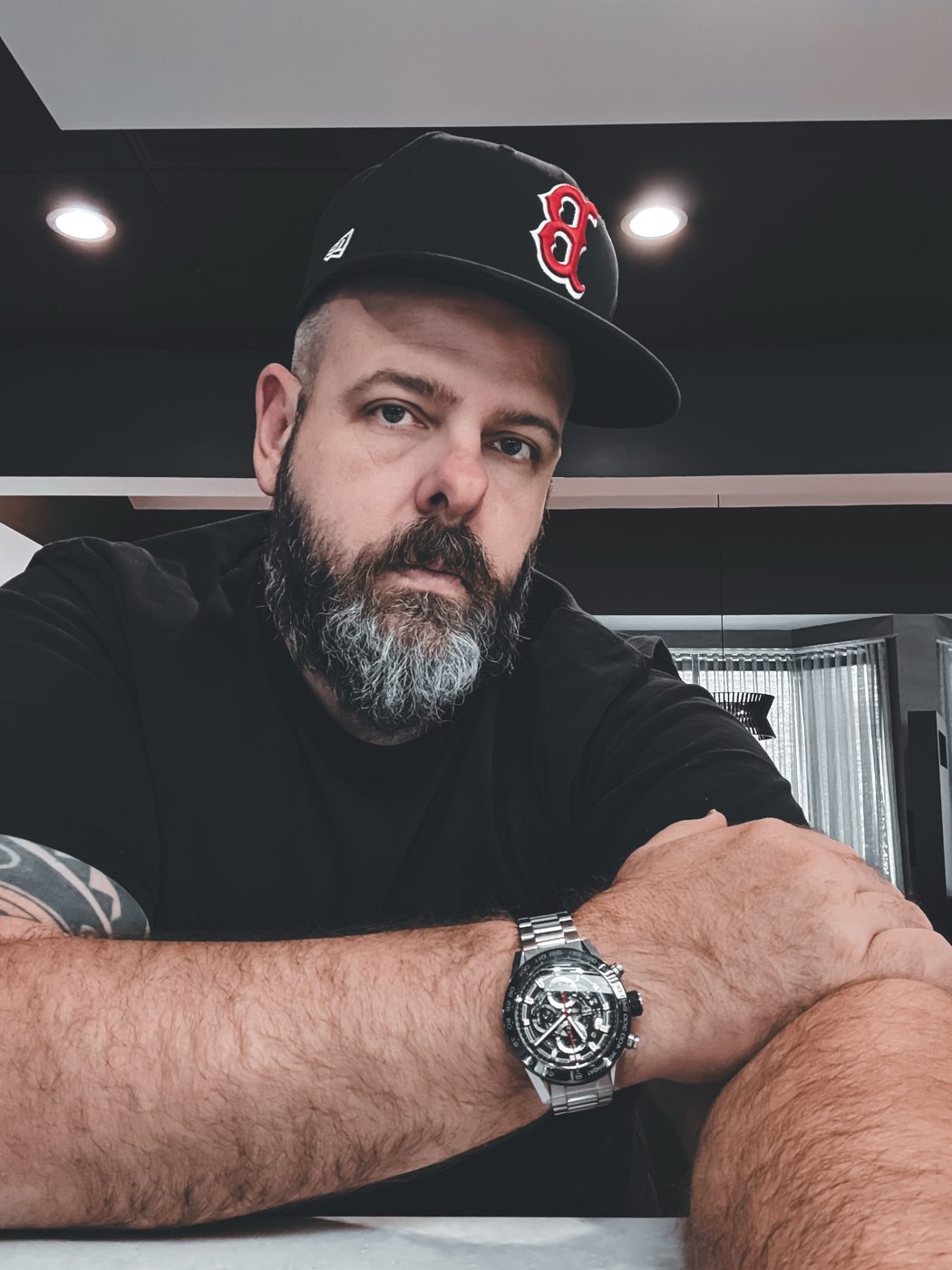 Brett Davis, arms crossed at a table