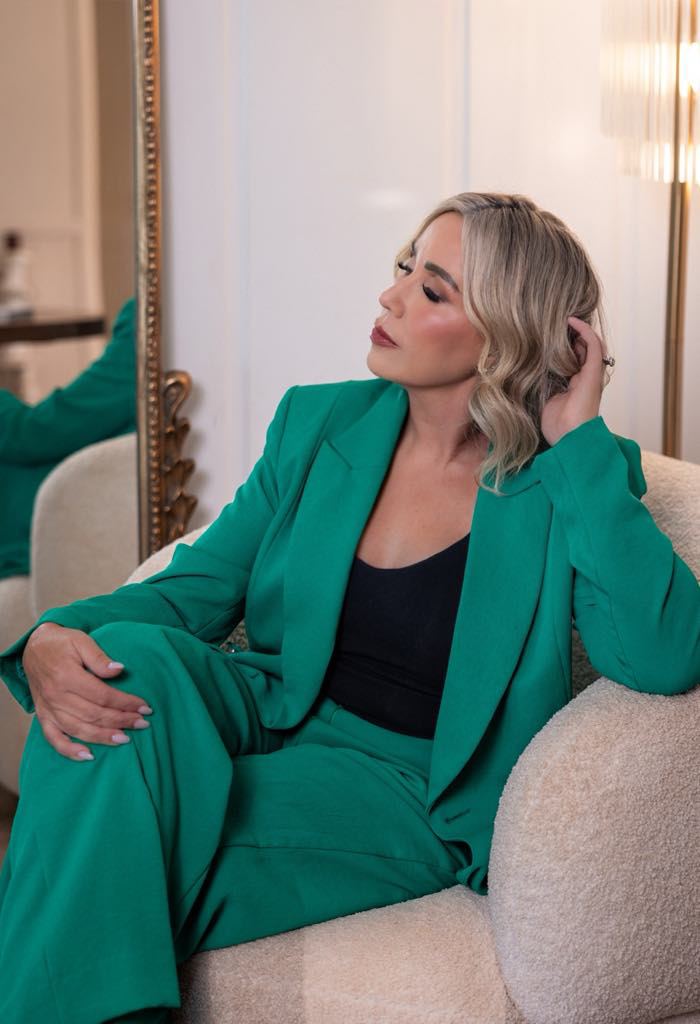 Samantha Gascoigne in a green suit